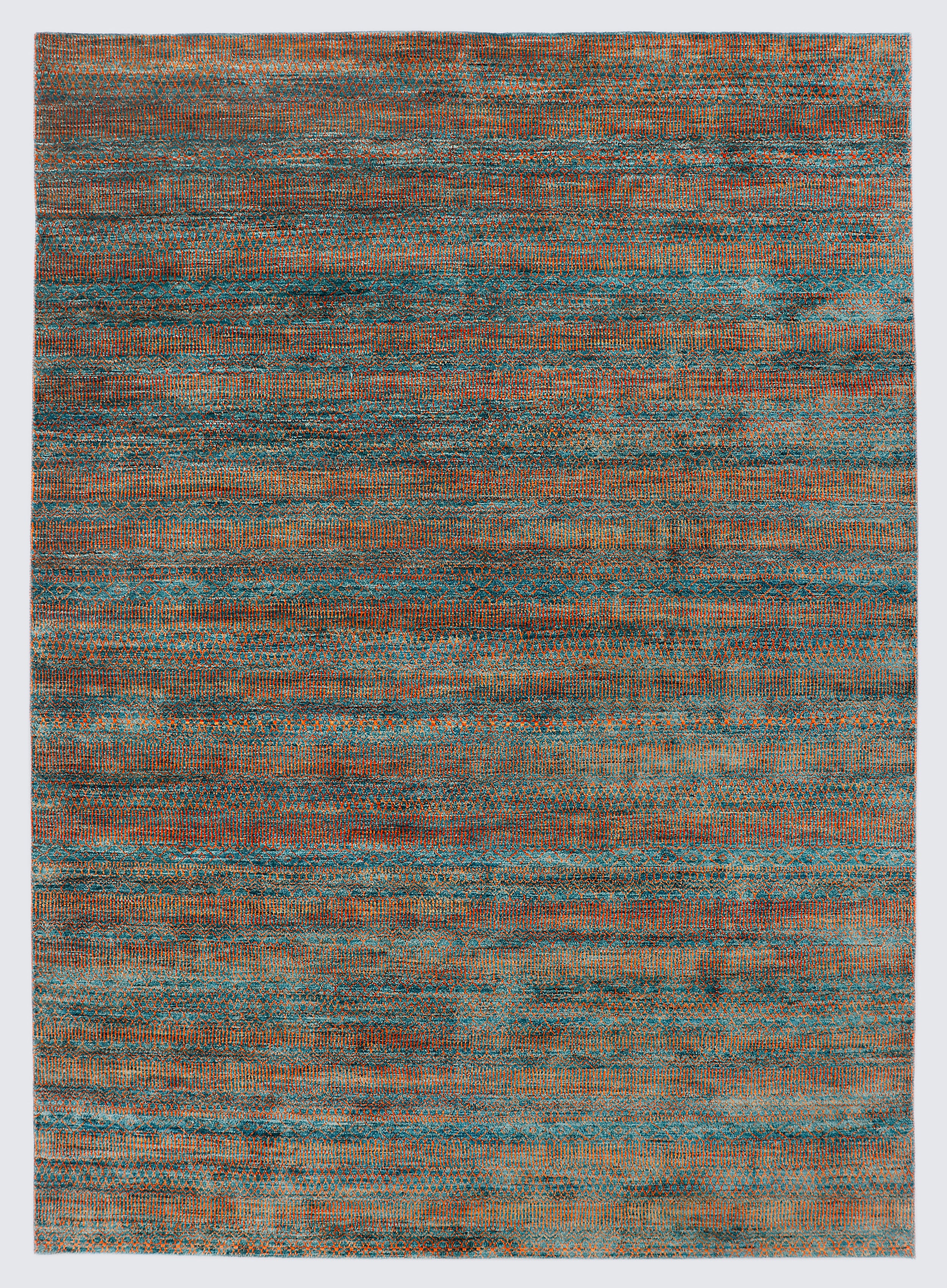 A full view of a vibrant hand-knotted double-knot Gabbeh rug from the Aatish collection, featuring horizontal bands of variegated orange tribal motifs over a textured malachite blue-green foundation.