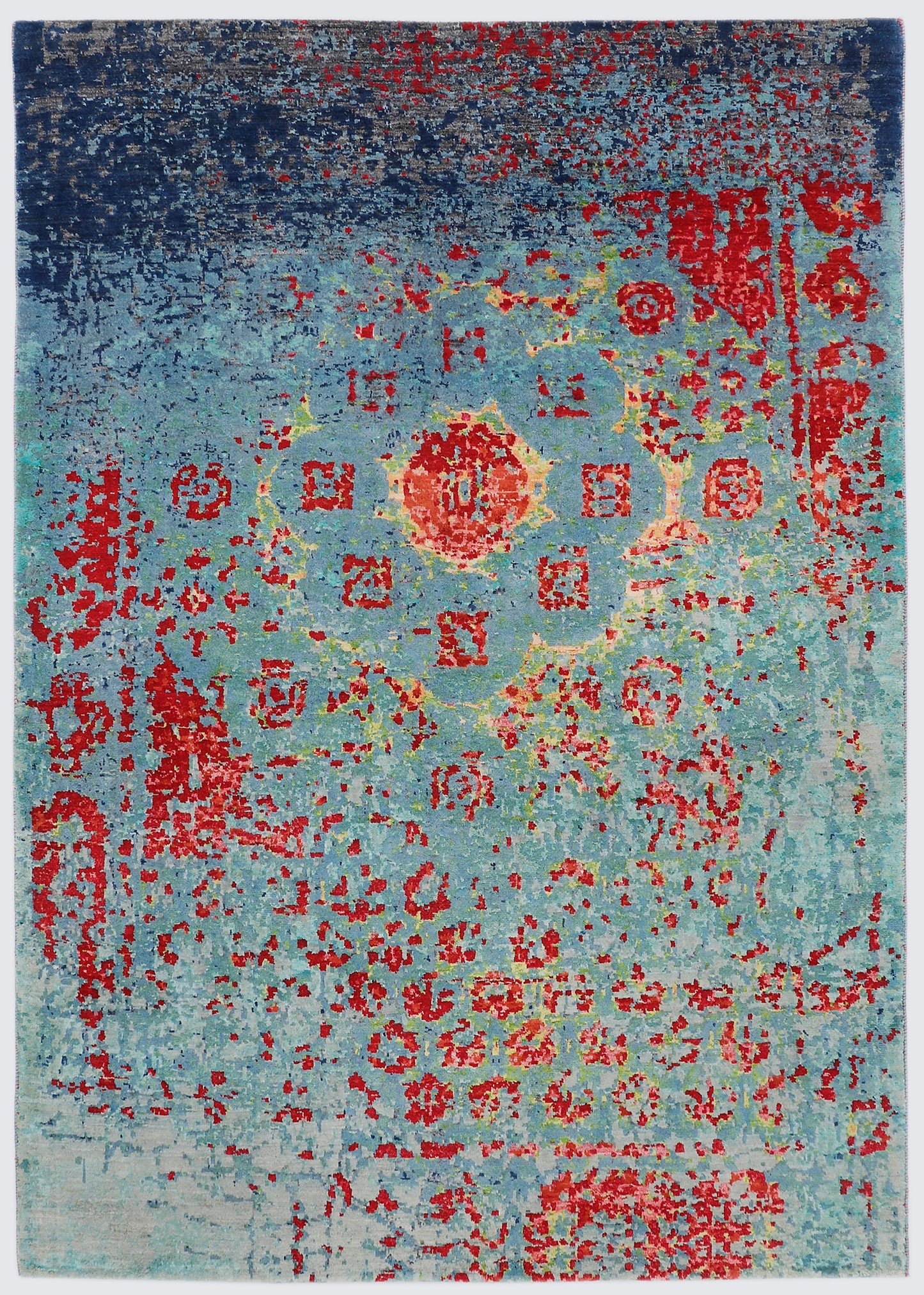 A full view of a hand-knotted transitional rug featuring a deeply distressed, abstract wash of oceanic blue and teal, with classical crimson red floral motifs and borders faintly emerging through the color.