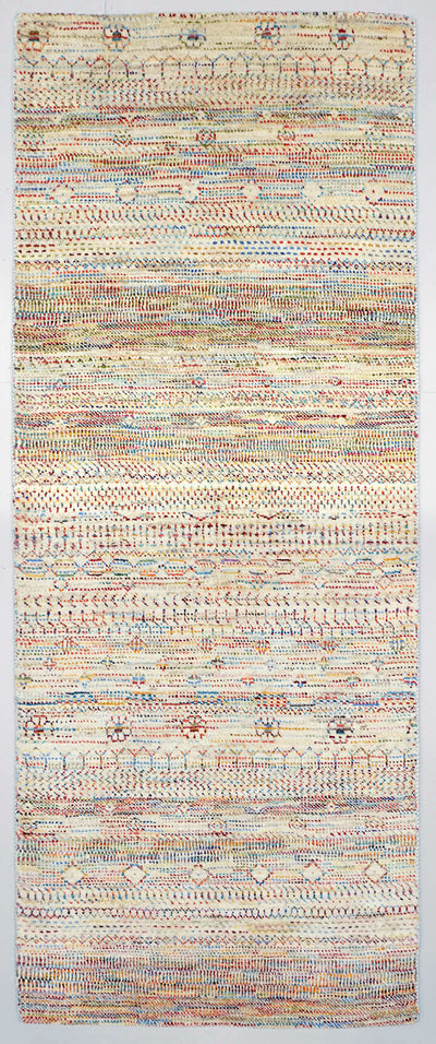 Full view of a natural white hand-knotted Aatish rug featuring rhythmic tiers of multi-colored Rasm motifs
