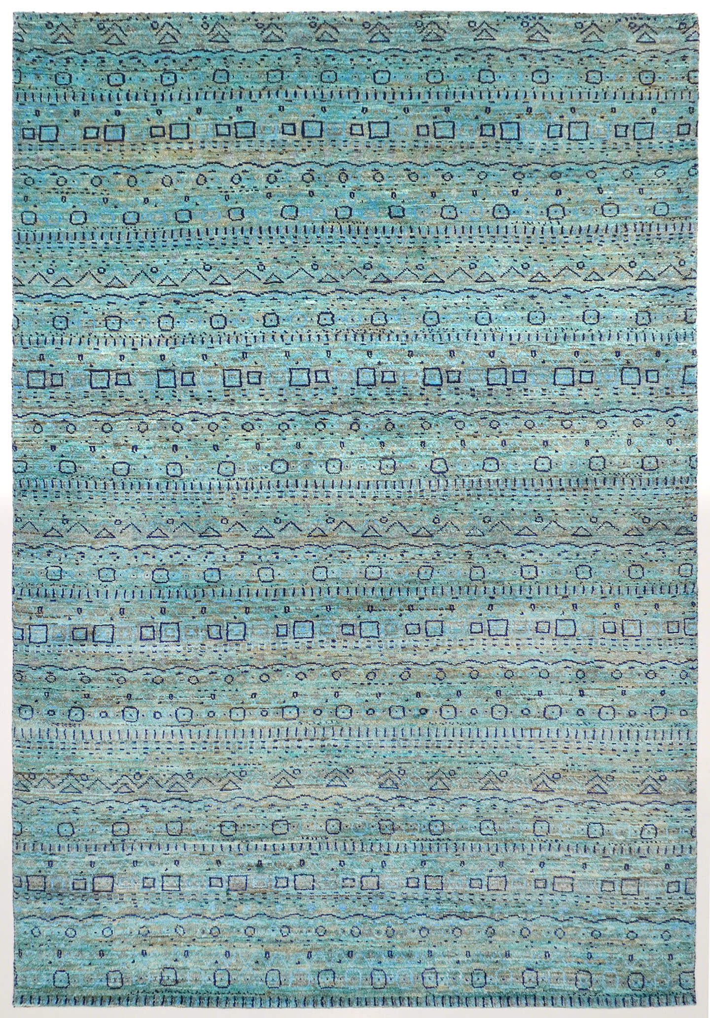 Full view of a turquoise hand-knotted Aatish Gabbeh rug featuring rhythmic levels of symbolic Bof motifs.