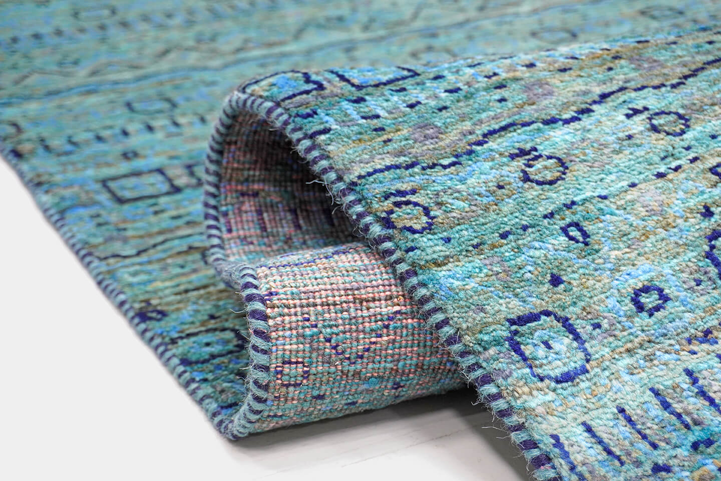 Close-up of the plush, hand-knotted wool pile and detailed indigo levels of the Azure Bof rug