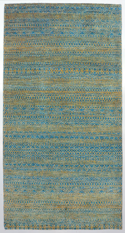 Full view of an azure blue hand-knotted Aatish rug featuring rhythmic tiers of golden Qila motifs