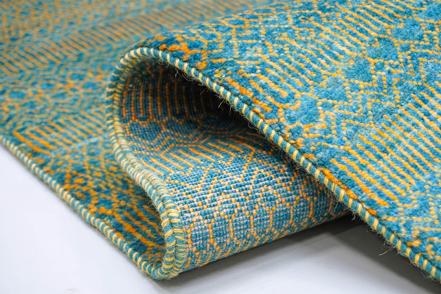 Close-up of the plush azure wool pile and detailed heritage Qila levels of the Azure Qila rug.