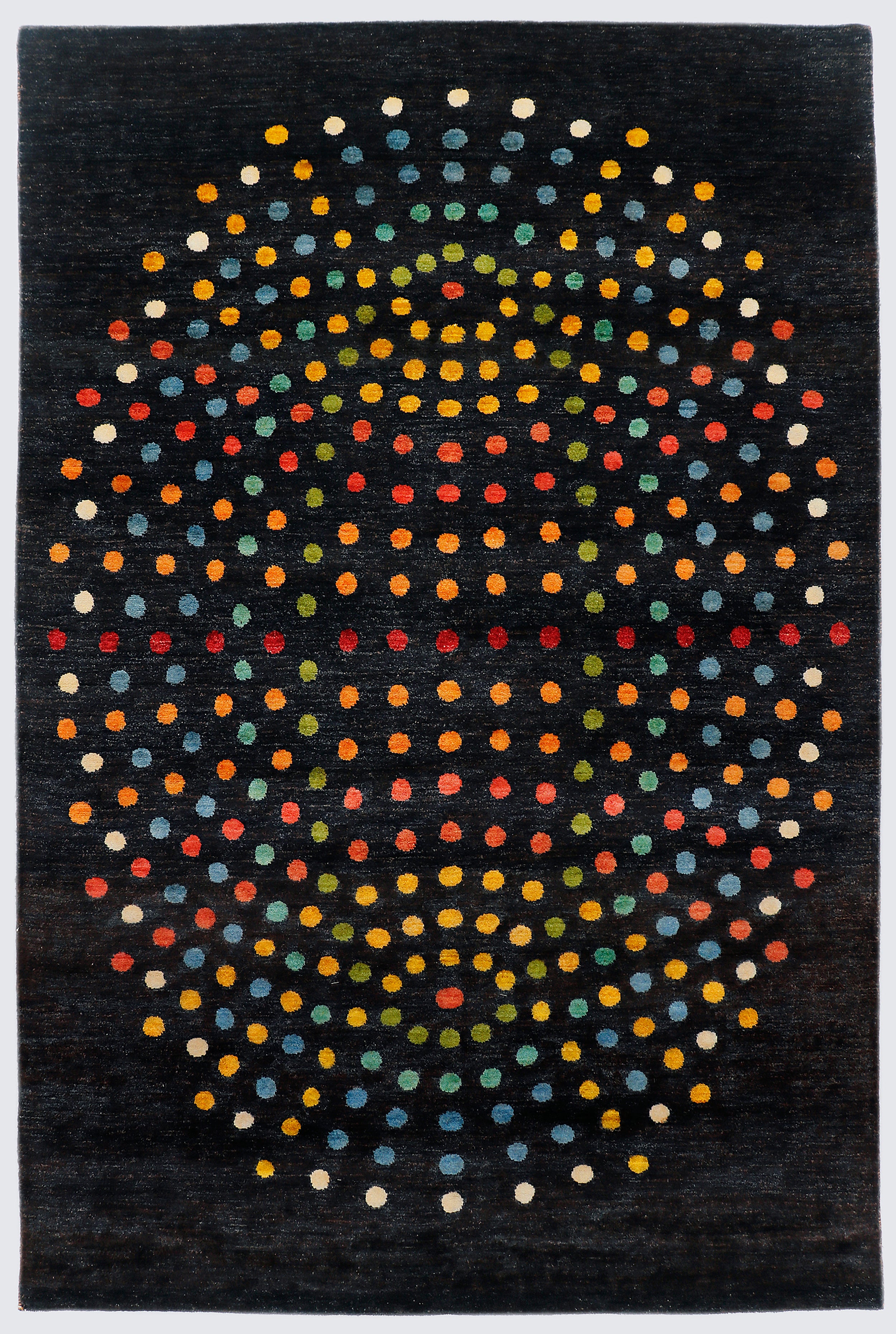 A full view of a modern abstract hand-knotted rug from the Fresco Edit, featuring a large, spherical arrangement of vibrant, multi-colored dots set against a solid deep black background.