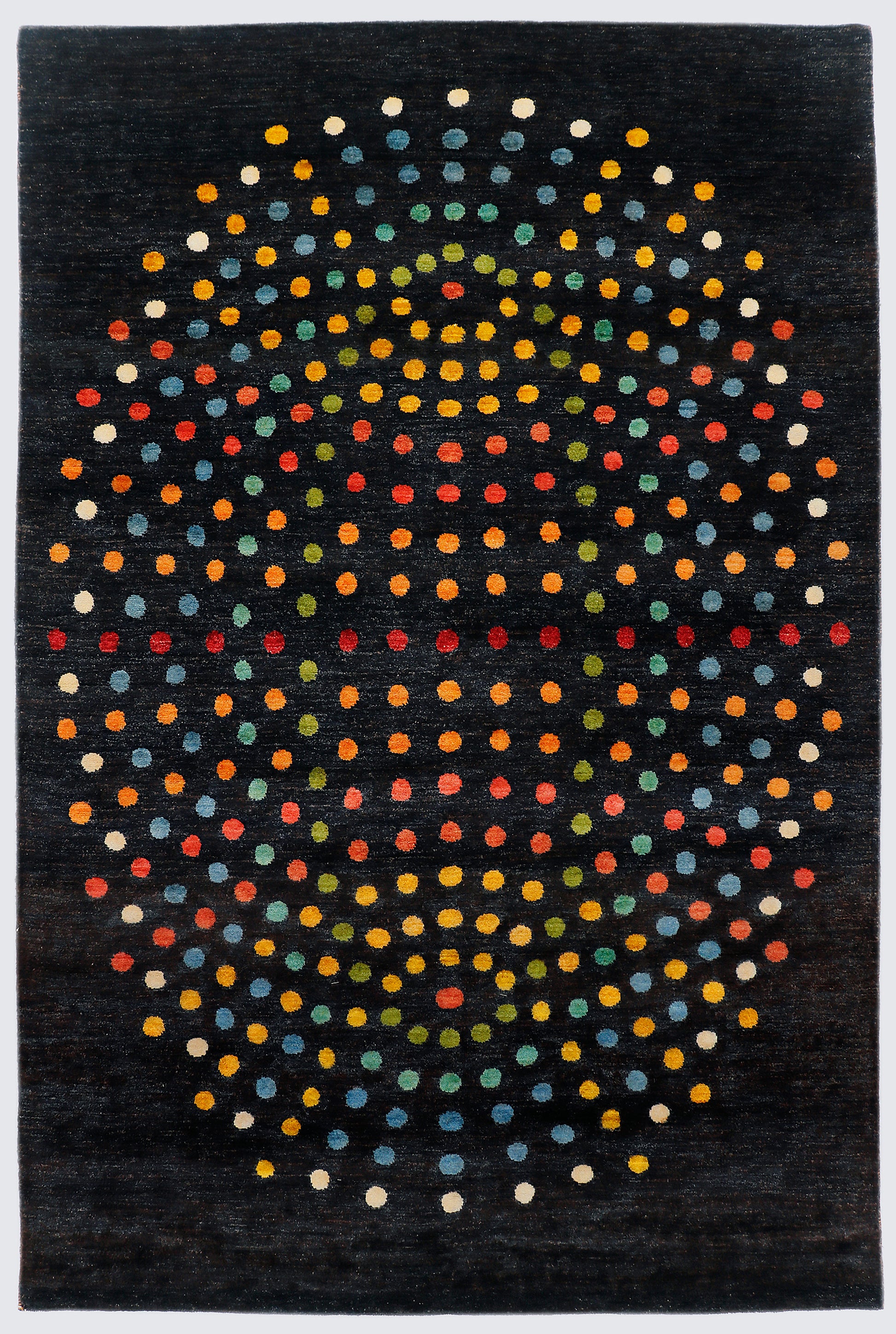 A full view of a modern abstract hand-knotted rug from the Fresco Edit, featuring a large, spherical arrangement of vibrant, multi-colored dots set against a solid deep black background.