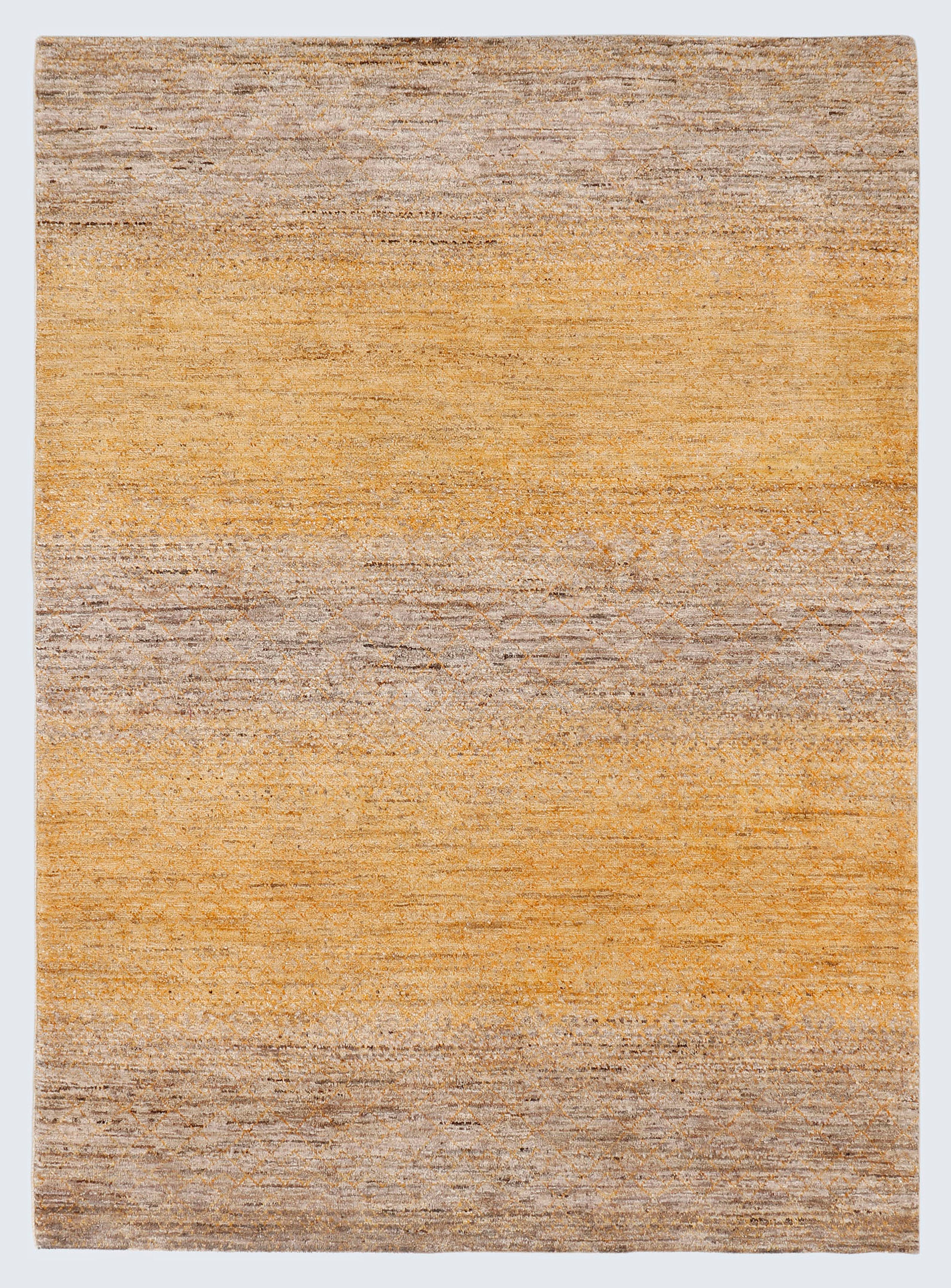 A full view of a minimalist hand-knotted wool rug featuring subtle horizontal striations and ghosted diamond motifs in warm golden ochre and earthy taupe.