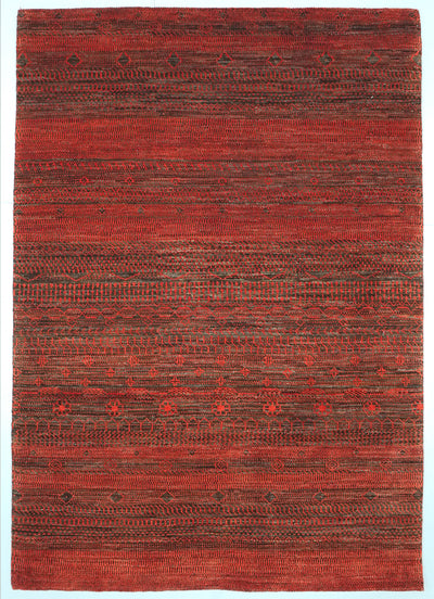Full view of a natural brown and Madder orange hand-knotted Aatish rug featuring rhythmic Nazar motifs