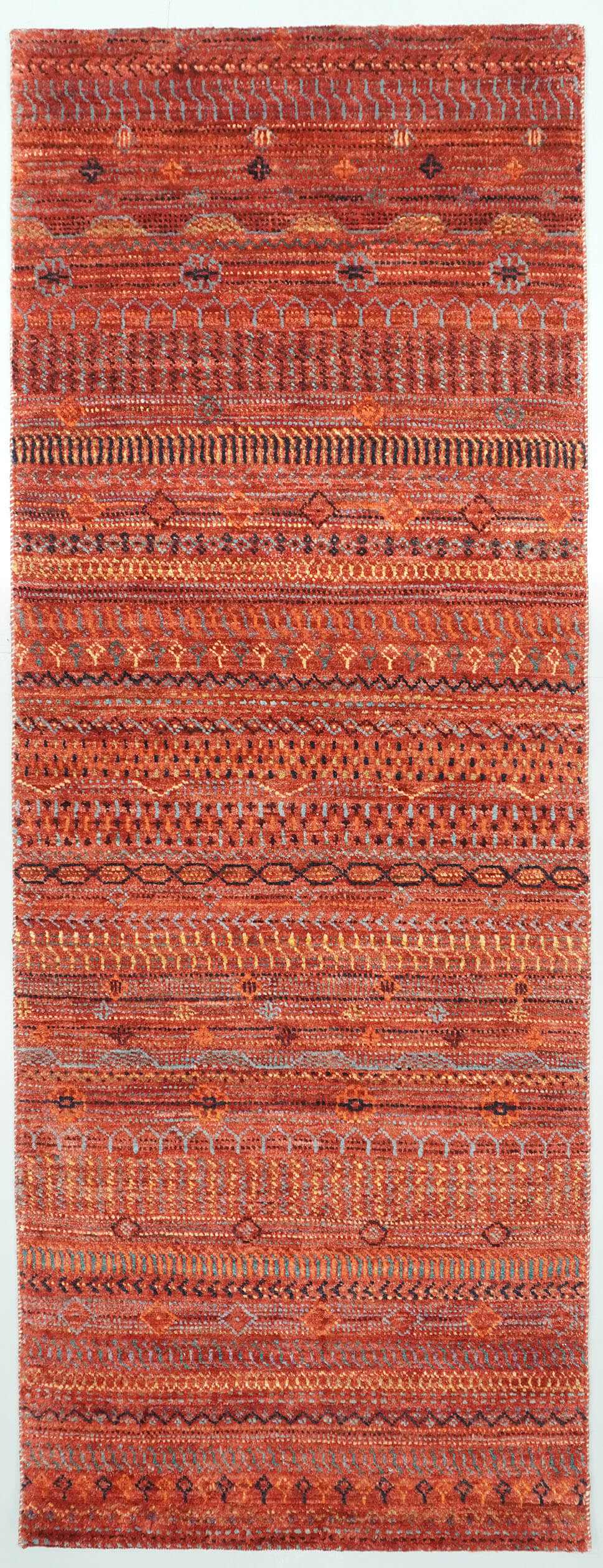 Full view of a Madder Rust deep red hand-knotted Aatish rug featuring rhythmic Tarh motifs.