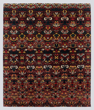 A full view of a dramatic, premium hand-knotted rug featuring repeating classical floral motifs in vivid garnet red and saffron gold against a deep midnight black foundation.