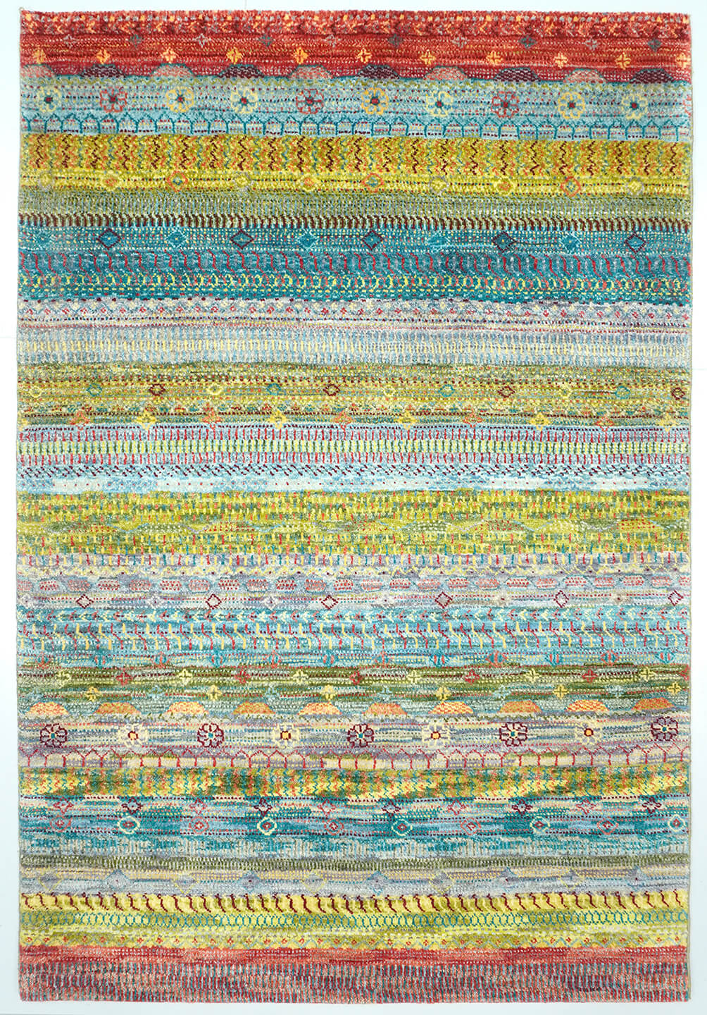 Full view of a multi-colored Opal hand-knotted Aatish rug featuring rhythmic tiers of heritage Baya motifs.
