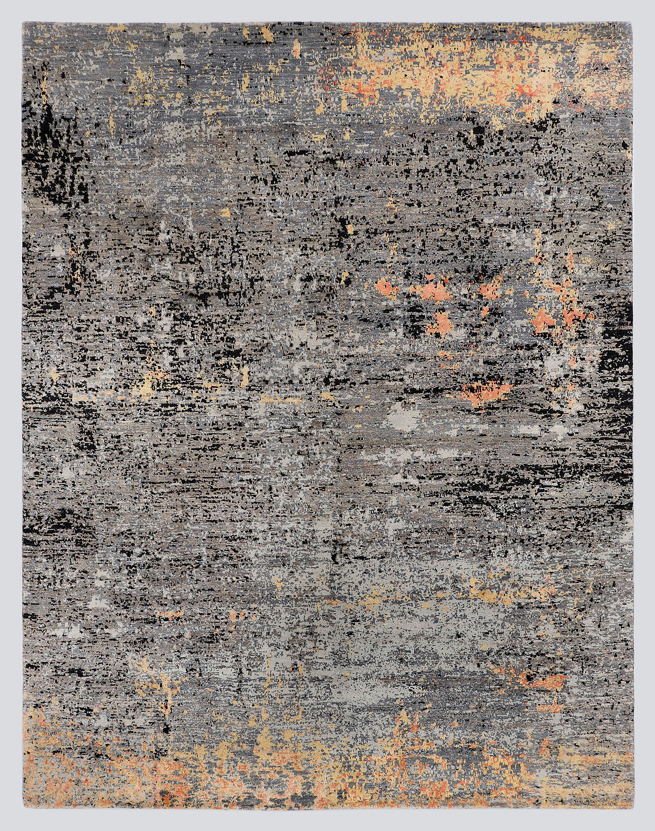 A full view of a modern abstract hand-knotted rug from the Fresco Edit, featuring a heavily distressed, kinetic pattern of charcoal grey, black, and burnt gold.