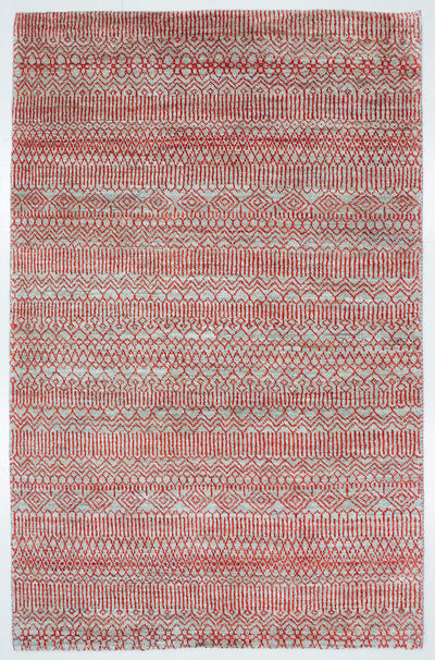Full view of a silver grey hand-knotted Aatish rug featuring a vibrating red Jali lattice.