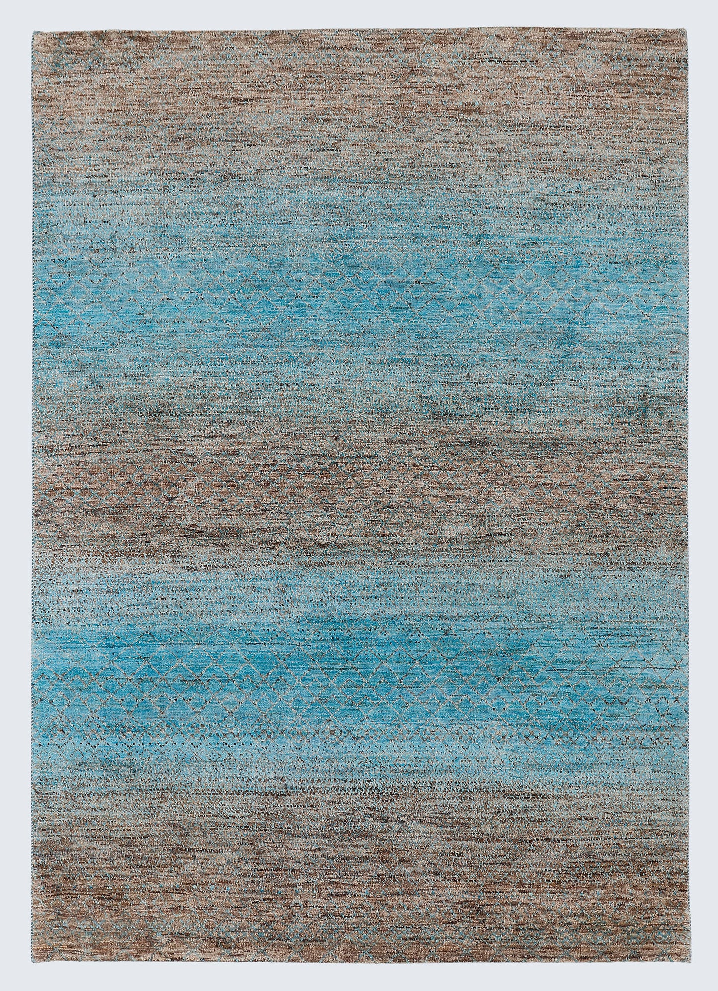 A full architectural view of a large hand-knotted Aatish Gabbeh rug featuring horizontal sea-blue and ochre bands over a raw, un-dyed natural brown wool foundation.