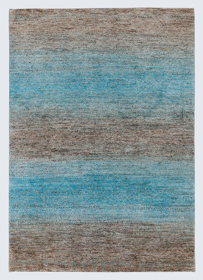A full architectural view of a large hand-knotted Aatish Gabbeh rug featuring horizontal sea-blue and ochre bands over a raw, un-dyed natural brown wool foundation.