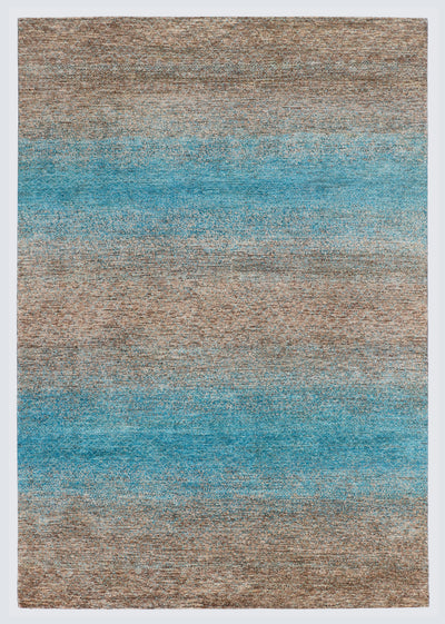 A full architectural view of a large hand-knotted Aatish Gabbeh rug featuring horizontal sea-blue bands over a natural, textured un-dyed wool base.