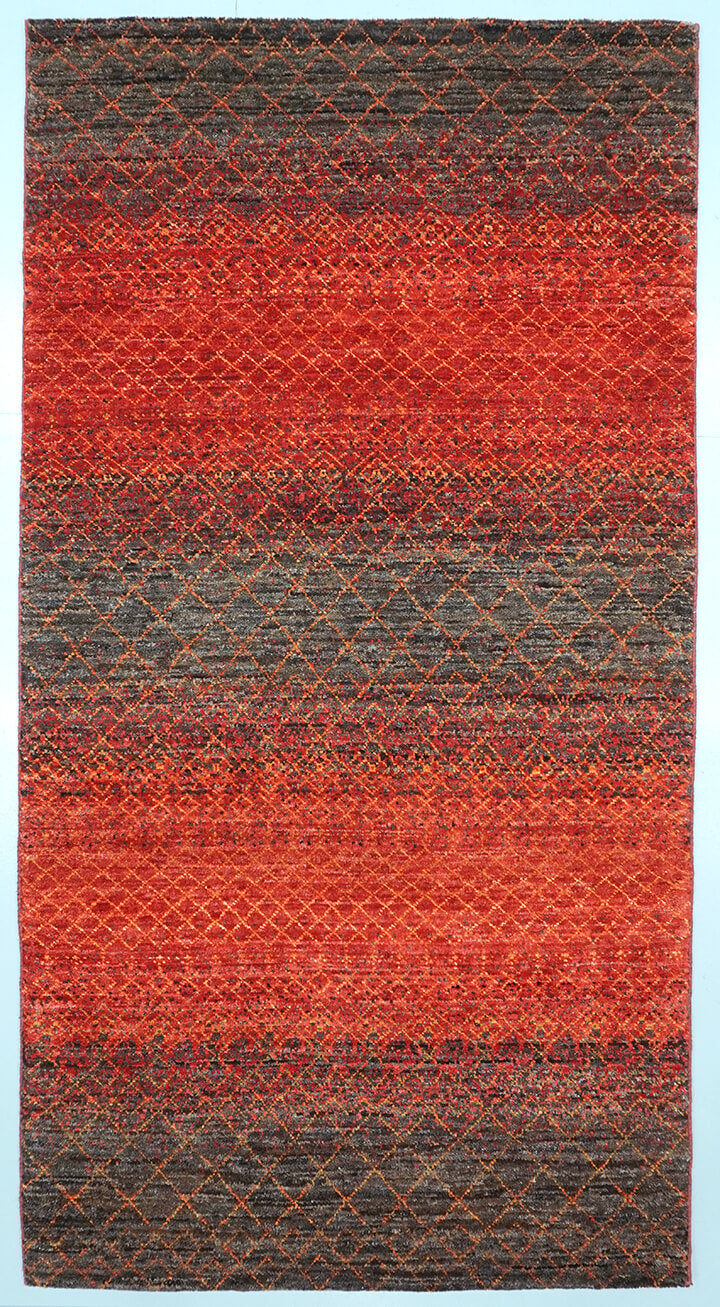 Full view of an Umber brown hand-knotted Aatish rug featuring vibrating orange and gold Mihrab motifs