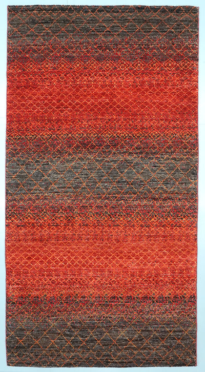 Full view of an Umber brown hand-knotted Aatish rug featuring vibrating orange and gold Mihrab motifs